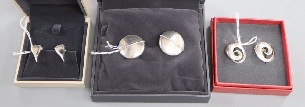 Vivianna Torun for Georg Jensen, a pair of sterling silver swirl design ear clips and two other pairs of Georg Jensen ear clips,